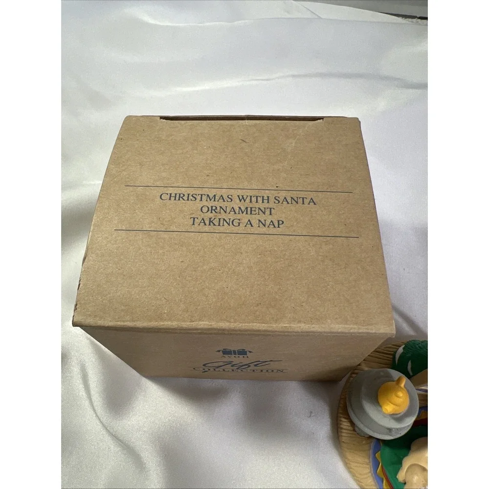 Vintage Avon Christmas with Santa Taking A Nap Ornament New In Box Resin Grandma